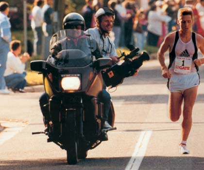 photo of Kevin shooting foot race action from a motocycle
